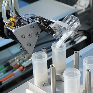 crystallization screening Robot with tilting glass vial with powder